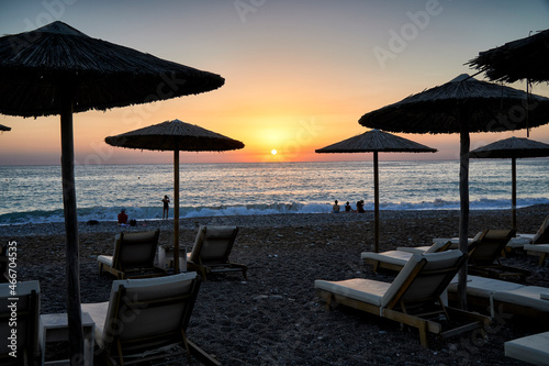 Fototapeta Naklejka Na Ścianę i Meble -  Beach Umbrellas with sunset