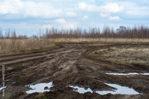 Bad country road. A dirt road damaged. Clay, dirt. Concept problem with the roads. human impact on the environment. Russian bad road