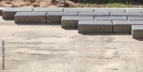 Laying paving slabs at a construction site.