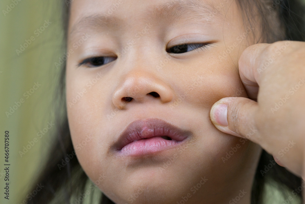 Asian mother and child girl playing pinch cheeks, touch nose funny face. Asian mother and child girl playing pinch cheeks, touch nose funny face.