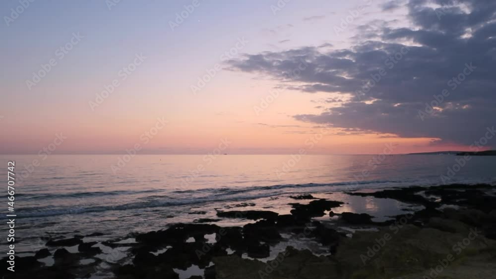 Romantic pink reflection of the sun in the Mediterranean Sea on the beach in Ayia Napa on the island of Cyprus Romantic pink reflection of the sun in the Mediterranean Sea on the beach in Ayia Napa on the island of Cyprus