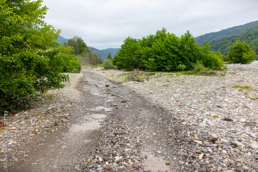 Fototapeta premium Dirt road in a mountainous area