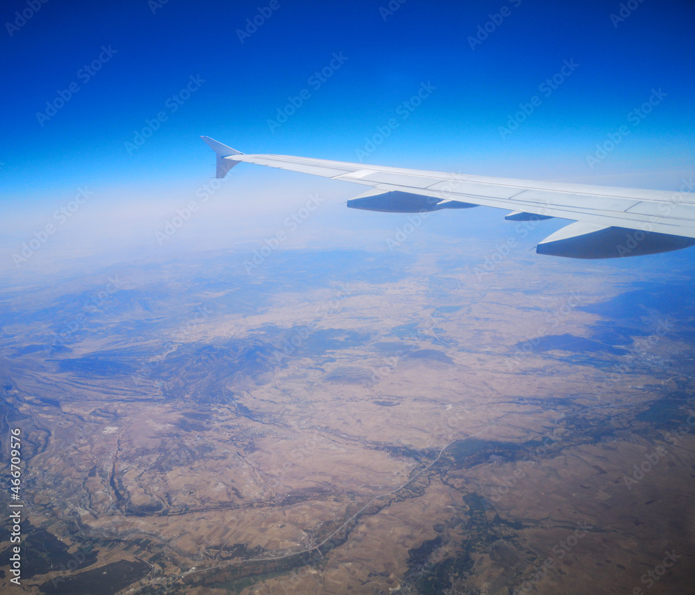 Airplane wing in sky in flight. Airplane wing in sky in flight.