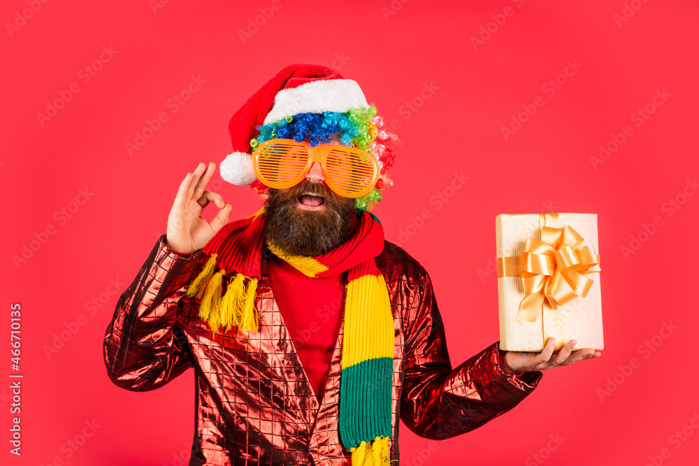 this perfect one. ready for party celebration. hipster enjoy the holiday. morning before Xmas. bearded man in party glasses. new year shopping idea concept. man in santa hat await christmas present