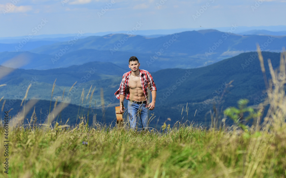 Guy hiker enjoy pure nature. Musician hiker find inspiration in mountains. Carefree wanderer. Vast expanses. Peaceful hiker. Conquer the peaks. Man hiker with guitar walking on top of mountain