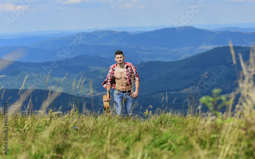 Guy hiker enjoy pure nature. Musician hiker find inspiration in mountains. Carefree wanderer. Vast expanses. Peaceful hiker. Conquer the peaks. Man hiker with guitar walking on top of mountain
