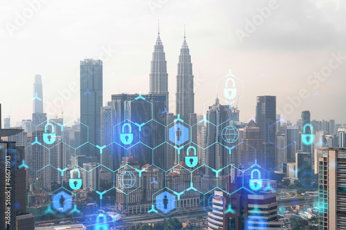 Photography Hologram of padlock icons over panoramic city view of Kuala Lumpur to protect business, Malaysia, Asia