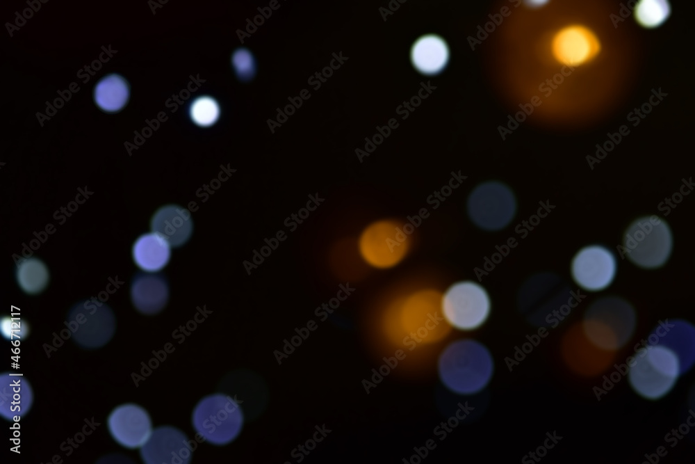 Christmas lights or bokeh in the dark background. Christmas or New Year's atmosphere. Place for your text.