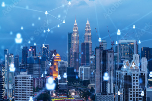 Canvas Print Glowing social media icons on night panoramic city view of Kuala Lumpur, Malaysia, Asia