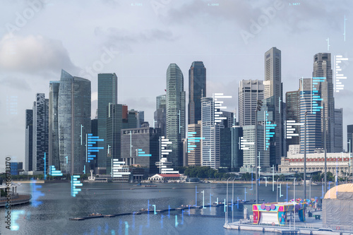 Financial stock chart hologram over panorama city view of Singapore  business center in Asia. The concept of international transactions. Double exposure.