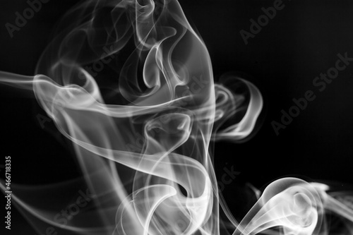 White  smoke motion on black background.
