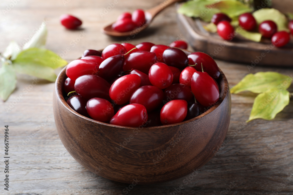 Fresh ripe dogwood berries on wooden table, closeup