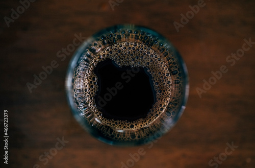 Coffee cup top view on wooden table background