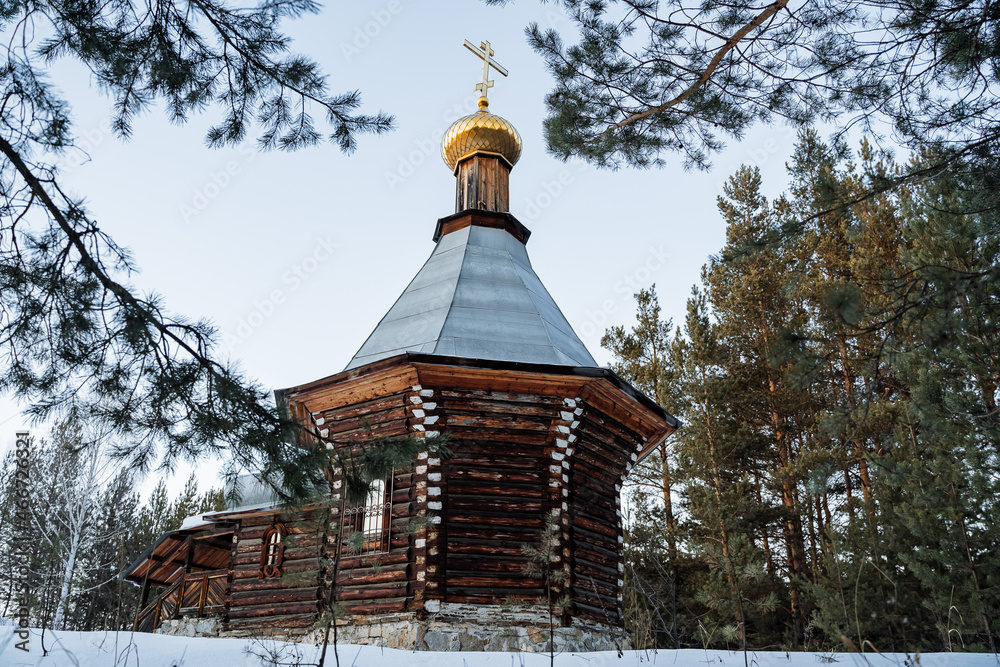 Orthodox church chapel stands in the winter forest. Russia Epiphany frosts. A place for prayer. The old church is lost in the taiga. Quiet location Orthodox church chapel stands in the winter forest. Russia Epiphany frosts. A place for prayer. The old church is lost in the taiga. Quiet location