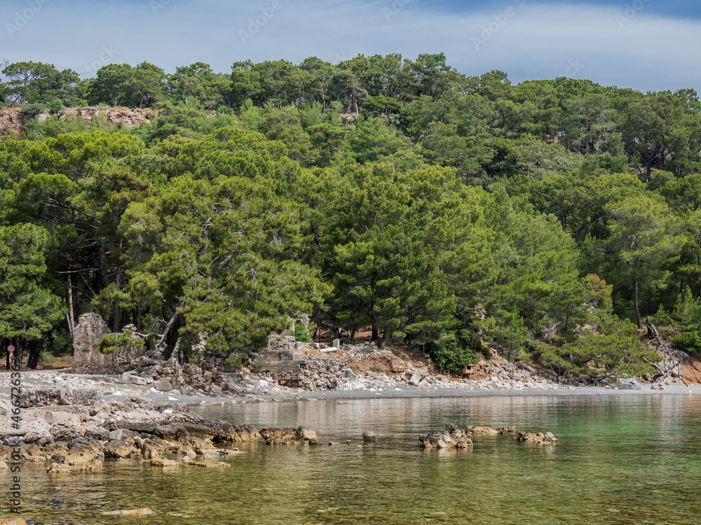 Northern Harbour of ancient city Phaselis. Ruins of Greek city on coast of ancient Lycia. Architectural landmark in Turkey. Northern Harbour of ancient city Phaselis. Ruins of Greek city on coast of ancient Lycia. Architectural landmark in Turkey.