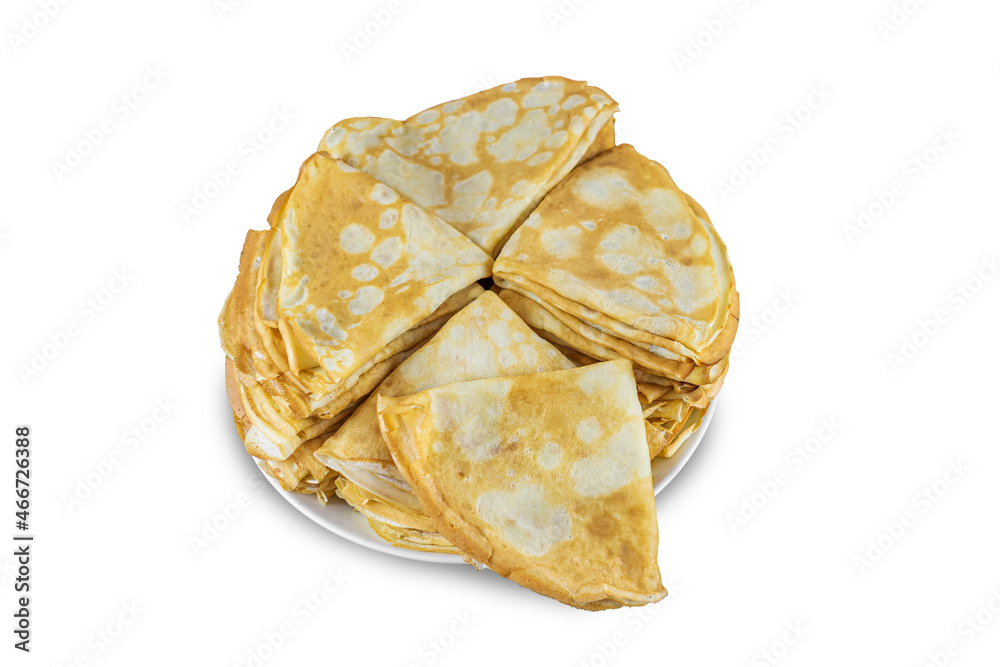 Freshly baked pancakes on a white plate isolated on a white background close-up, top view Freshly baked pancakes on a white plate isolated on a white background close-up, top view