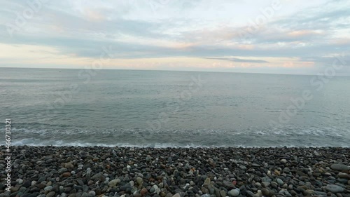 Wallpaper Mural Morning on the seashore. A pebble beach and gentle sea waves roll onto the shore Torontodigital.ca