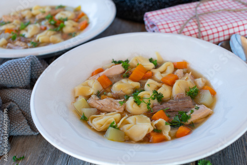 Rustic chicken noodle soup cooked with tortellini