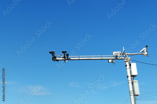 road cameras on a pole against the sky