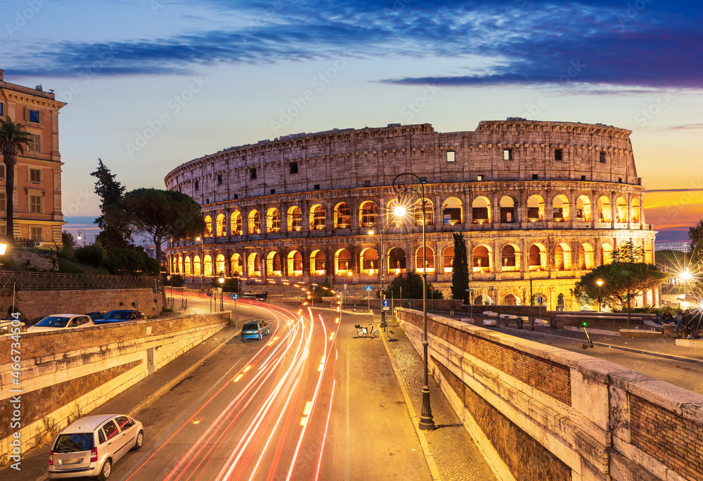 Beautiful view on Colosseum and a road nearby at sunset, Rome, Italy