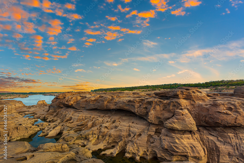 grand canyon,Ubon Ratchathani,Scenery of Eroded large rocky rapids gorge with Mekong river and colorful sky in the sunset