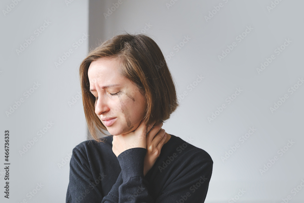 Young Female Crying And Strangling Herself. Concept Of Violence Against Women. Sexual And Gender-Based Violence. Soft focus Young Female Crying And Strangling Herself. Concept Of Violence Against Women. Sexual And Gender-Based Violence. Soft focus