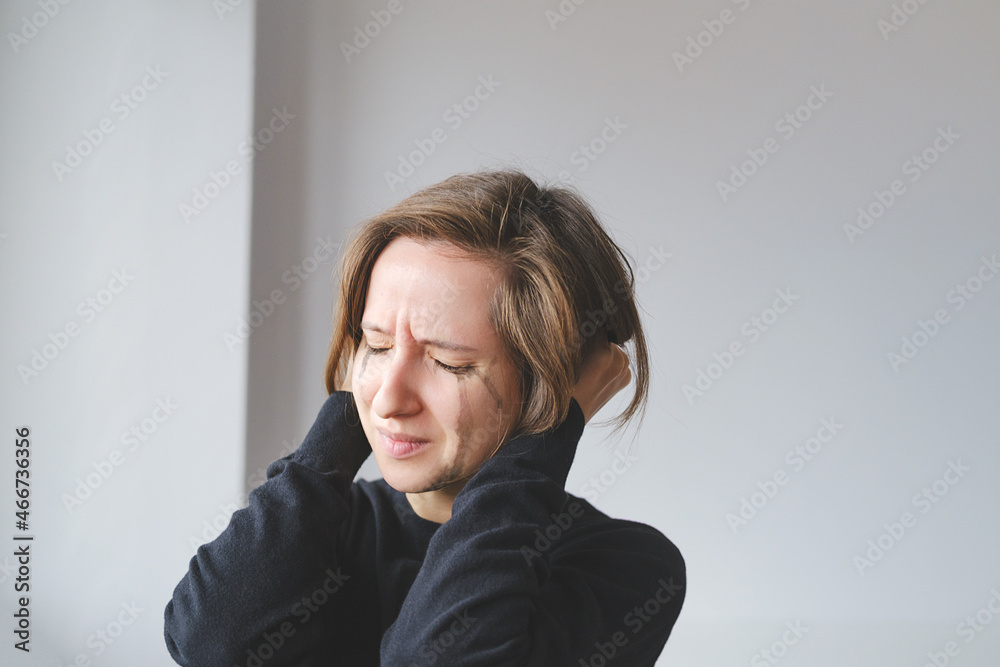 Young Female Crying And Rips Hair. Concept Of Violence Against Women. Sexual And Gender-Based Violence. Soft focus Young Female Crying And Rips Hair. Concept Of Violence Against Women. Sexual And Gender-Based Violence. Soft focus