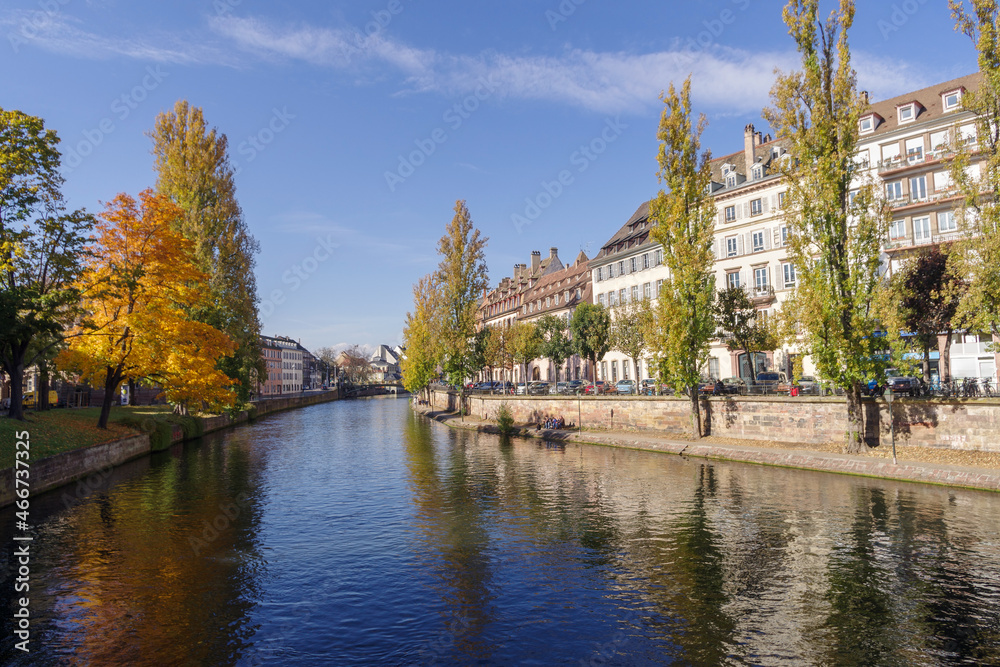 France, Strasbourg, Ill River canal with promenade and row of townhouses