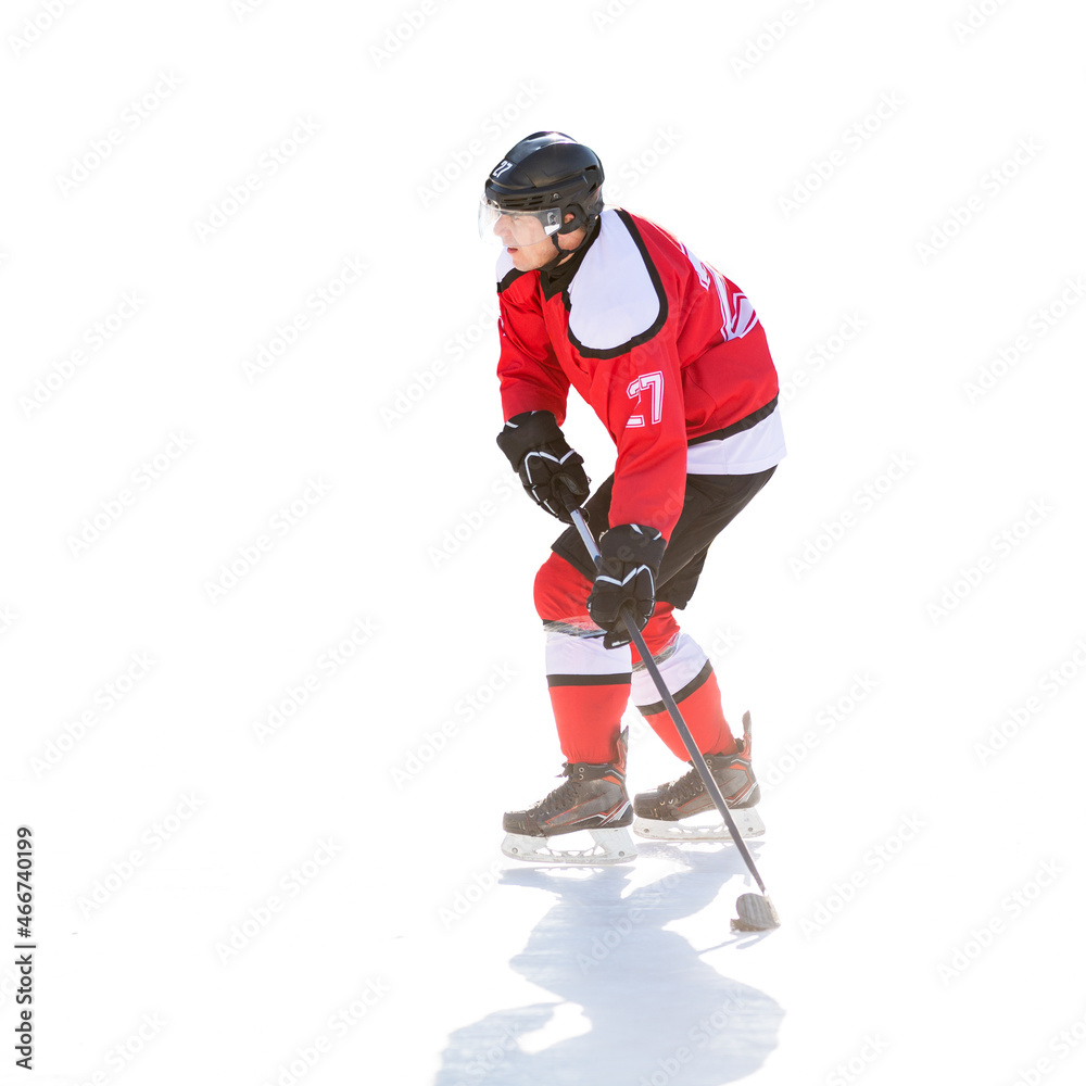 Professional ice hockey player in attack on the rink. Isolated image on white Professional ice hockey player in attack on the rink. Isolated image on white