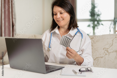 doctor recommends pills online. female doctor consults patient in video chat. female doctor live talk looking and speaking at laptop computer work in online clinic to help patient on telemedicine