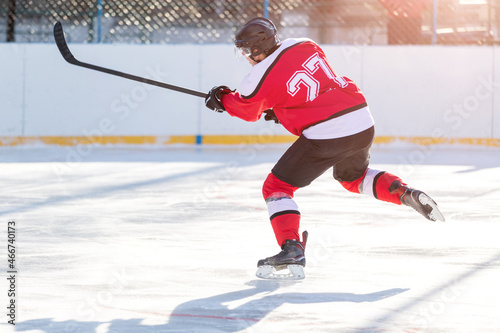 Photography Professional ice hockey player in attack on the rink.