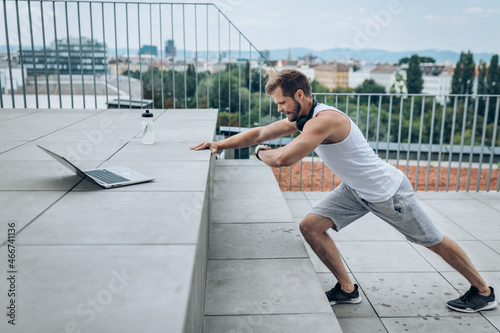 Handsome man training and working out outdoors