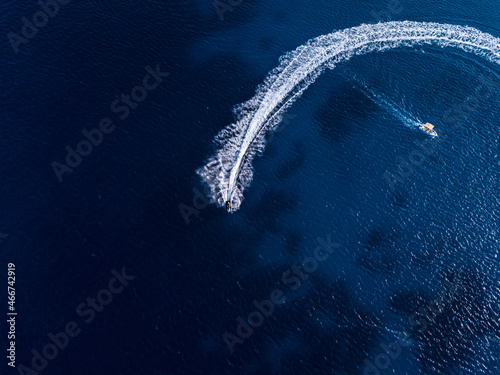 Aerial view on jetski and speed boat in tropical blue waters