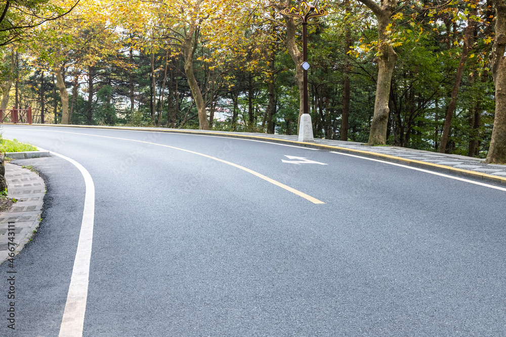 Fototapeta premium mountain road in autumn forest