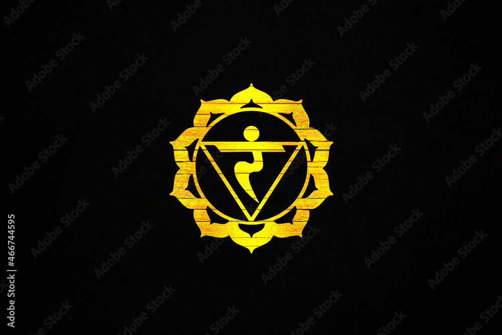 Manipura chakra, sacred symbol on a black canvas Manipura chakra, sacred symbol on a black canvas