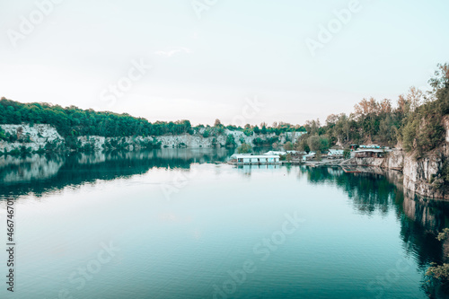Summer landscape with small blue lake in forest. Crystal clear water © Shi 