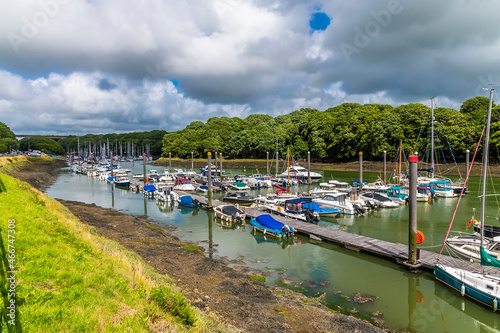 A view up Westfield Pill showing boats moored at Neyland, Pembrokeshire, South Wales on a summers day photo