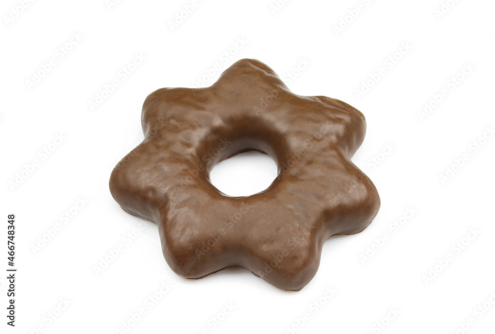 Single star shaped gingerbread biscuit covered in chocolate and isolated on white background Single star shaped gingerbread biscuit covered in chocolate and isolated on white background