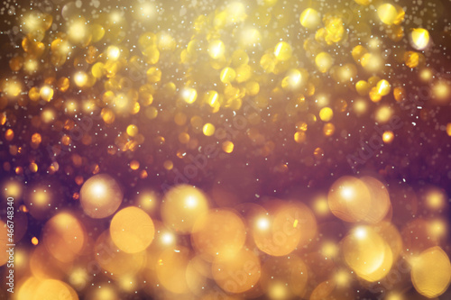 Golden bokeh blurred glitter lights background newyear eve