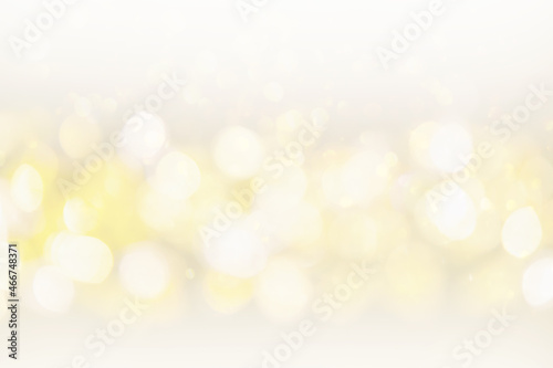 Silver, white and golden blur bokeh in New Year eve and copy space. Abstract background holiday.