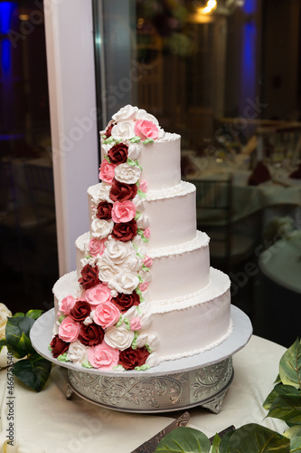 white wedding cake with roses