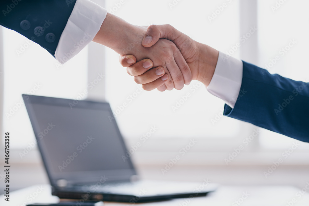 colleagues shaking hands successful deal office laptop professionals colleagues shaking hands successful deal office laptop professionals