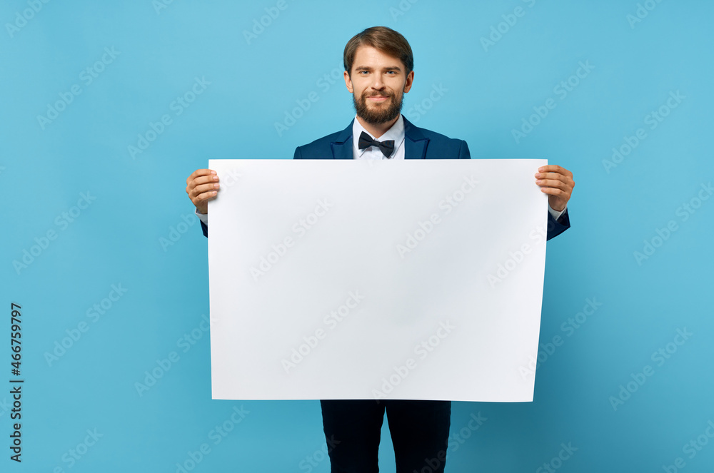 Cheerful man white paper in the hands of marketing isolated background Cheerful man white paper in the hands of marketing isolated background
