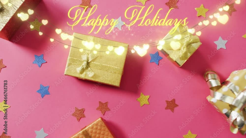 Animation of happy holidays text over christmas presents Animation of happy holidays text over christmas presents