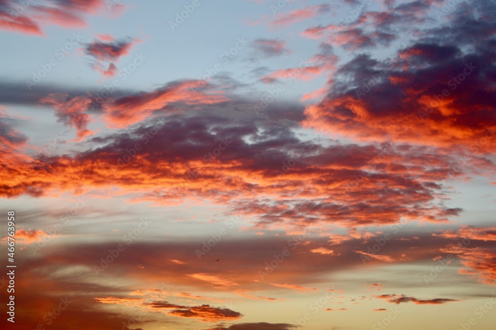 red sky with clouds during the sunset