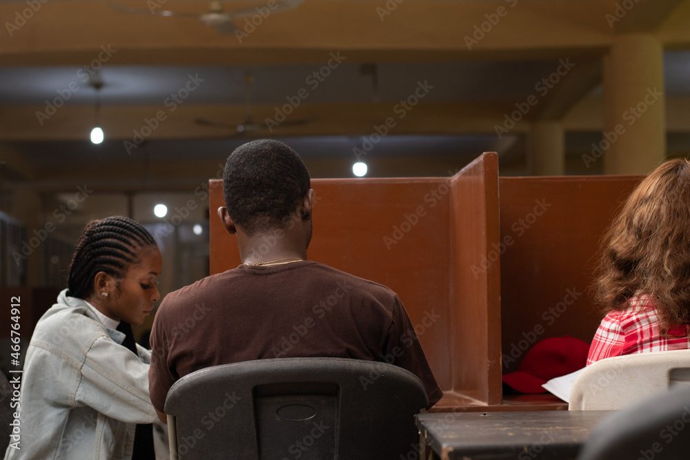 some african students studying in a school library some african students studying in a school library