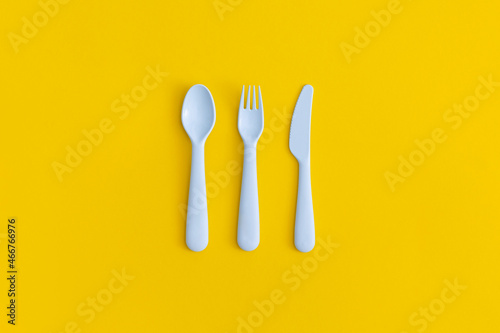 Food plastic packaging on yellow background. Concept of Recycling plastic and ecology.