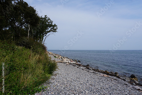 Ein Strand mit Steinen bei Bagenkop auf Langeland in Dänemark photo