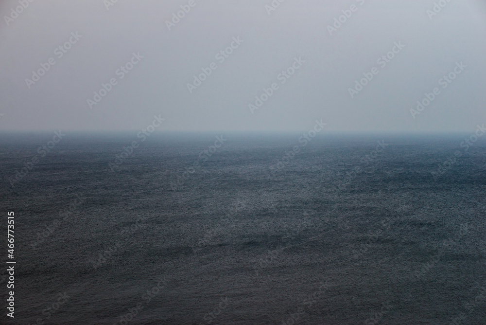 horizon of the sea in storm and fog