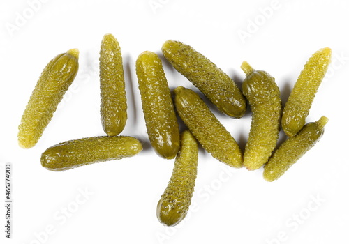 Pickled gherkin pile, pickles isolated on white background, top view